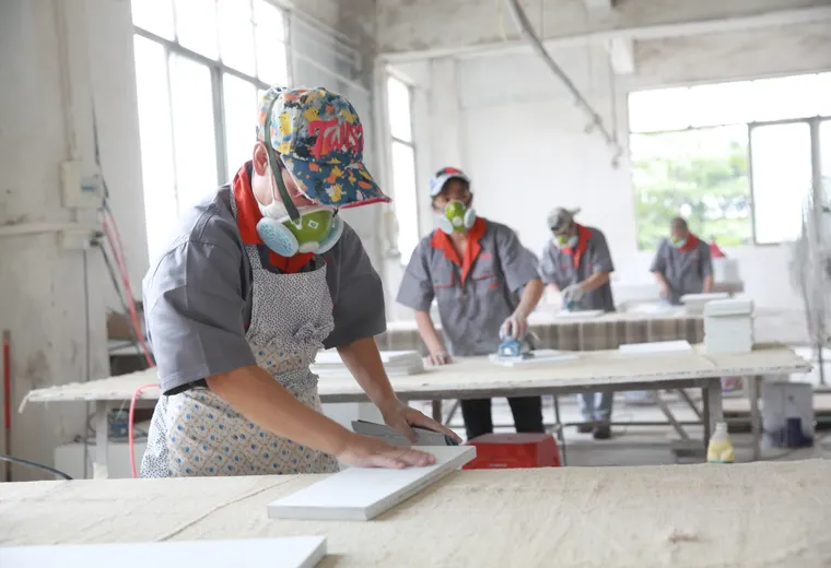 Team checking fit and function of assembled fixture